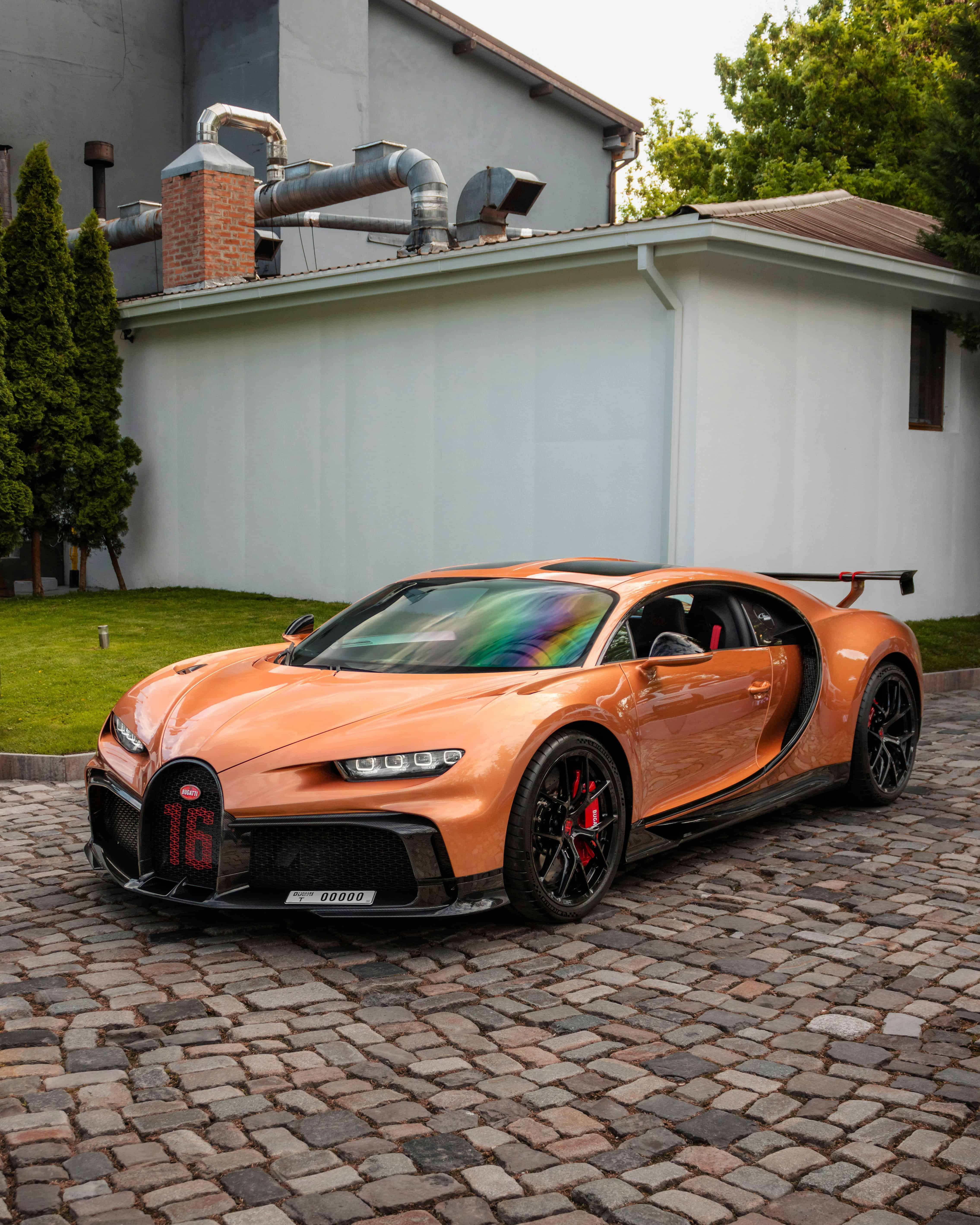 Supercar lifestyle with Mercedes-AMG GT and Bugatti Chiron on open road